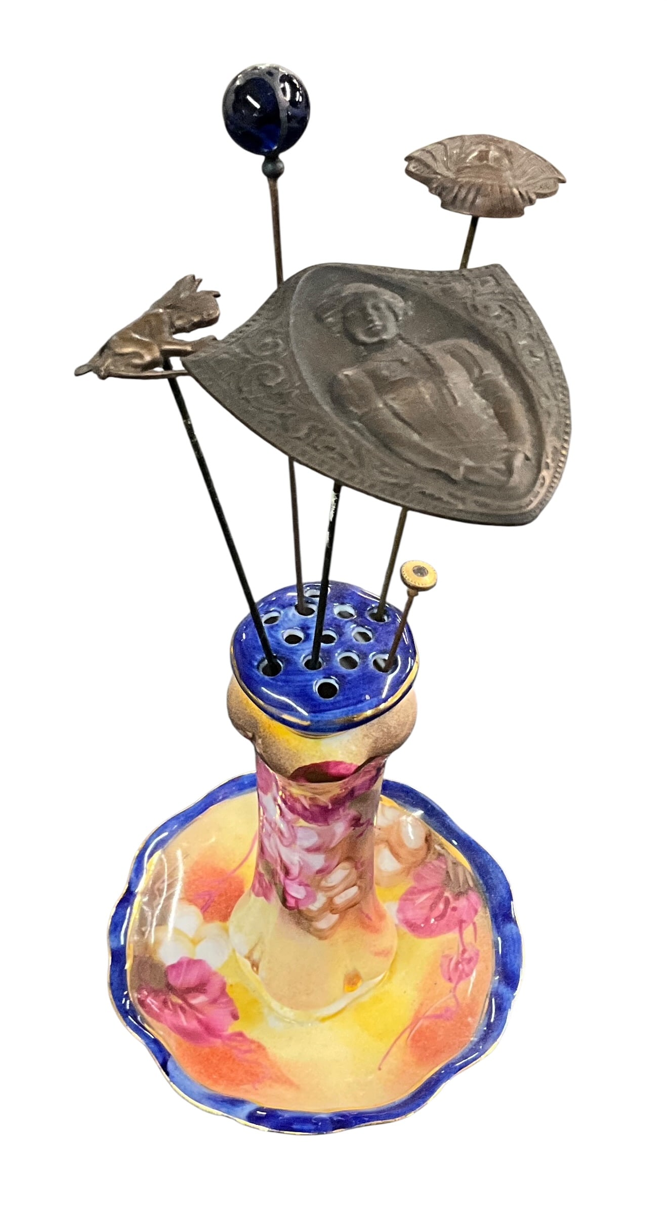 Limoges Porcelain Hatpin Holder with Figural Hatpins: Antique Limoges porcelain hatpin holder, marked --Limoges China-? to underside, featuring a vibrant hand-painted floral design with pink blossoms and a cobalt blue rim. The form includes a scalloped b