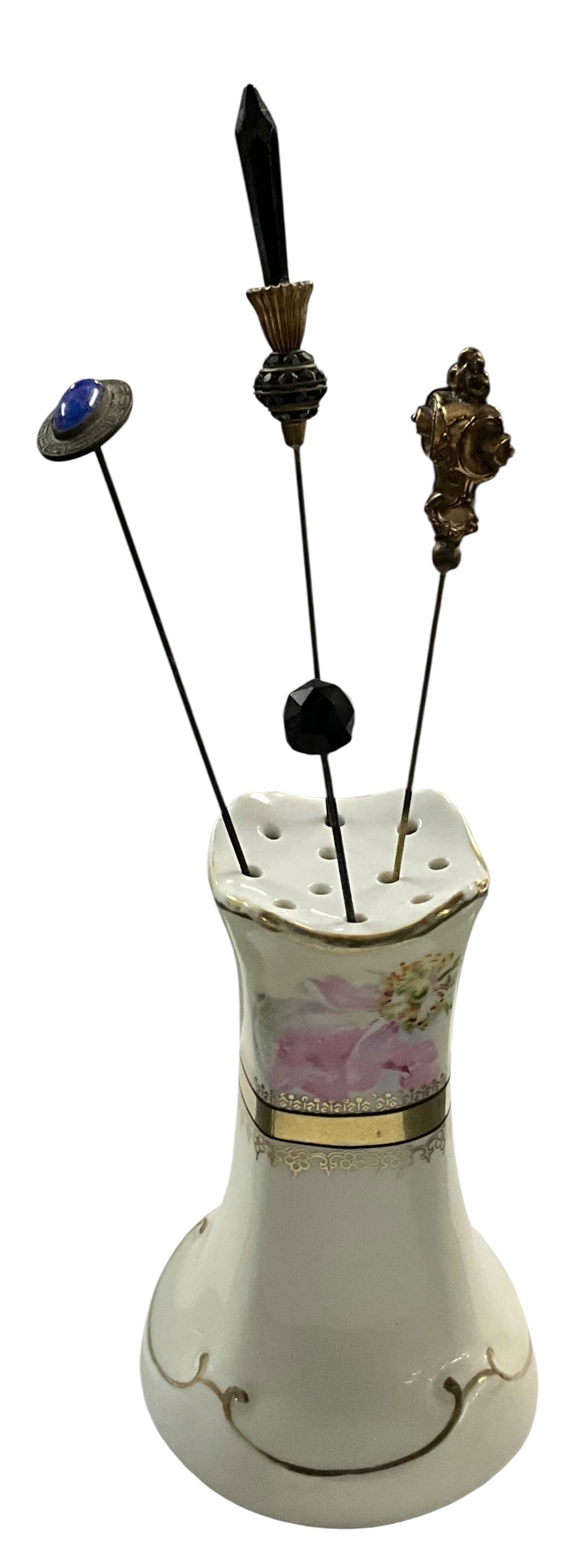 Antique Bavaria Hand-Painted Porcelain Hatpin Holder with Four Hatpins: Antique porcelain hatpin holder marked Bavaria on underside, featuring a graceful flared form with scalloped rim, soft ivory glaze, and delicate hand-painted pink floral decoration accented by gilt ba