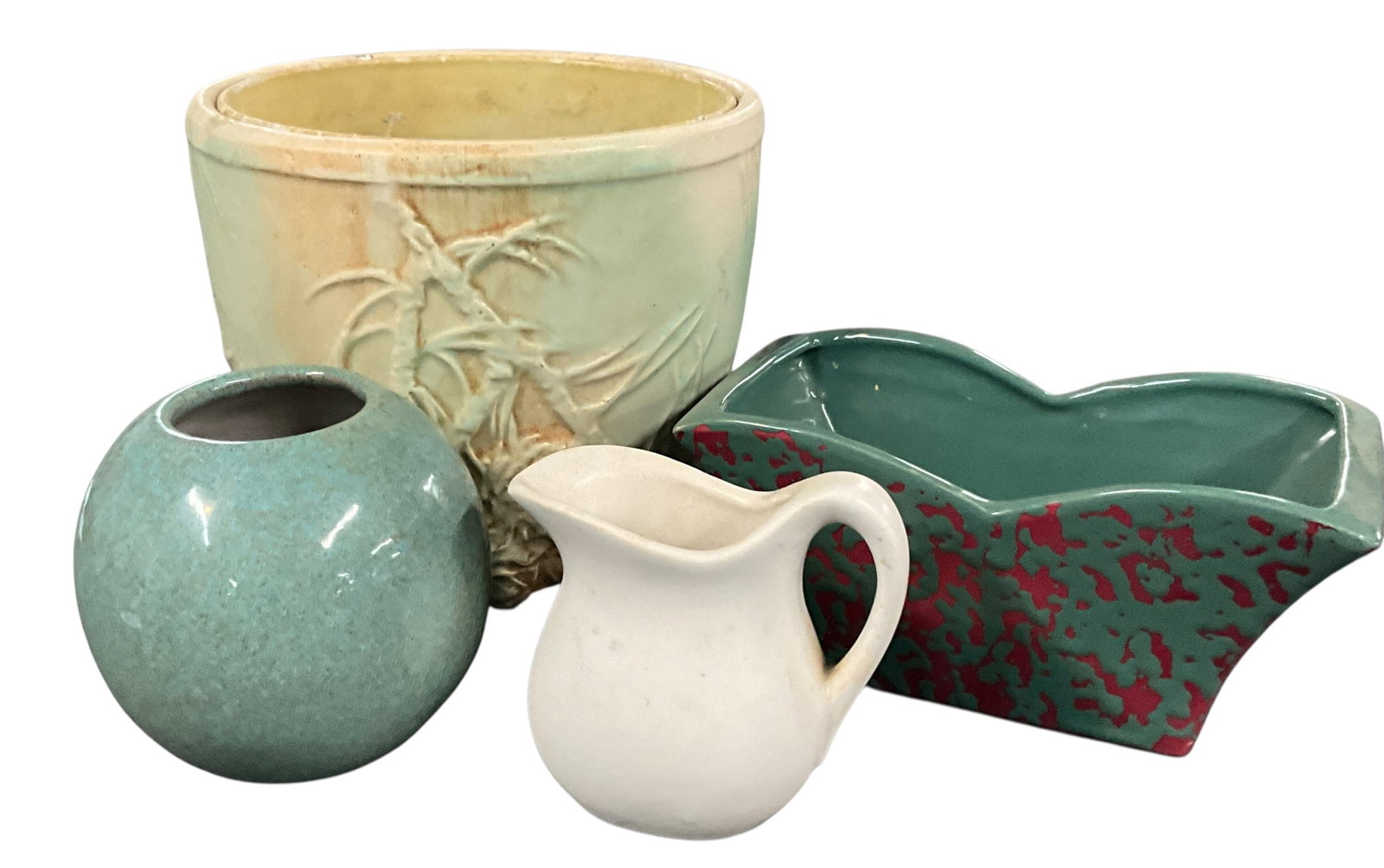 Commercial Art Pottery Group Including McCoy Planter and Decorative Vessels: A group of four commercial art pottery pieces representing a variety of mid-century and later decorative ceramic styles. The lot includes a McCoy planter with molded bamboo motif and marked underside,