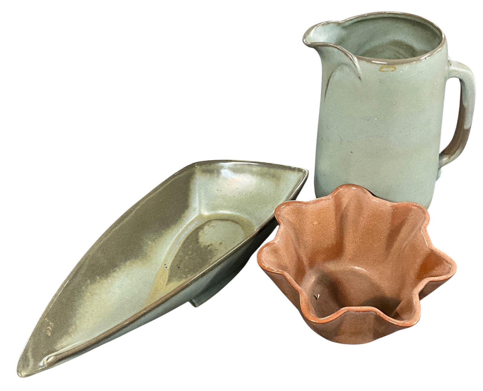 Frankoma Art Pottery Group Pitcher, Bowl & Console Dish: A grouping of Frankoma art pottery including a handled pitcher in soft sage glaze, a fluted bowl in warm brown glaze marked Frankoma 103, and an elongated console dish marked Frankoma 240. Each piece 