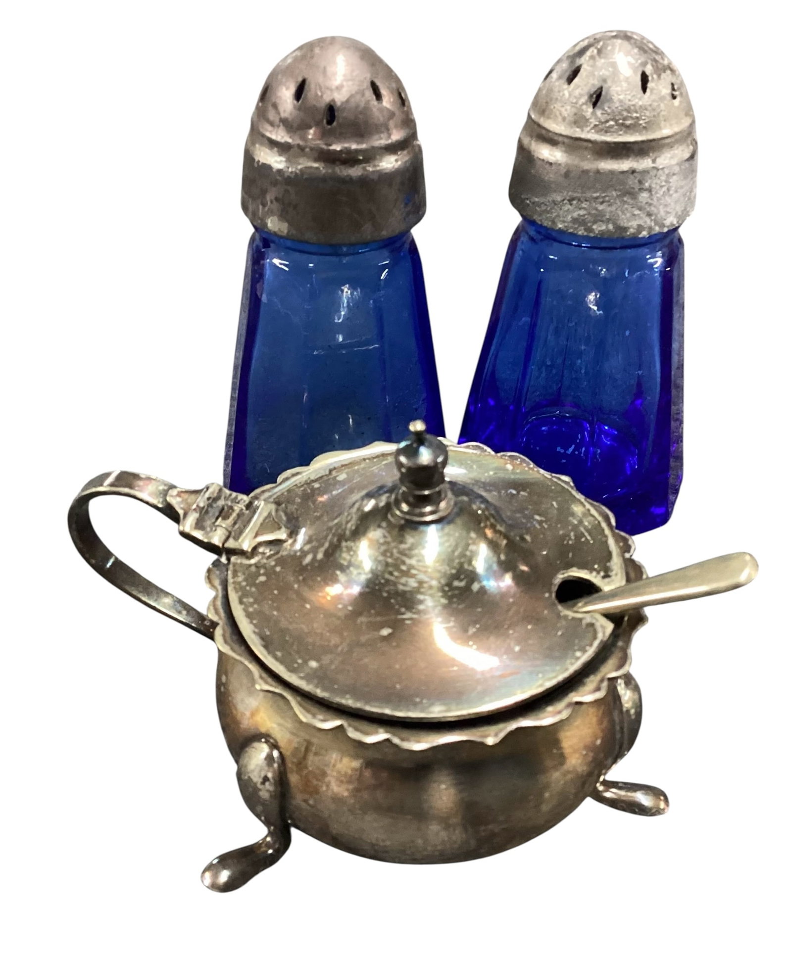 Collection of Cobalt Blue Glass and Silverplate Tableware: Collection of cobalt blue glass and silverplate tableware including footed insert bowl with lid, and pair of cobalt blue glass salt and pepper shakers. Includes blue glass liners and silverplate or si