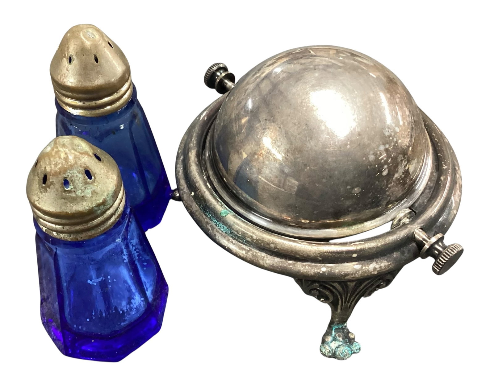 Silver Plate Cobalt Glass Salt & Pepper Shakers with Tilting Open Salt Cellar: Vintage silver plate condiment grouping featuring a pair of cobalt blue glass salt and pepper shakers with silver-tone tops, accompanied by a tilting open salt cellar with cobalt blue glass insert. Th