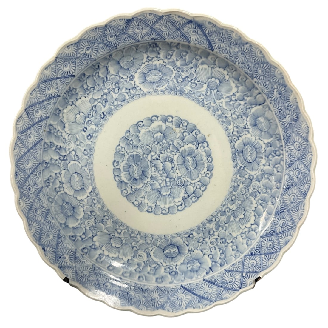 Large Blue & White Floral Decorated Porcelain Charger: Large scalloped-edge porcelain charger measuring approximately 18.5 inches in diameter, decorated in underglaze blue with dense floral and scrollwork motifs surrounding a central floral medallion. The