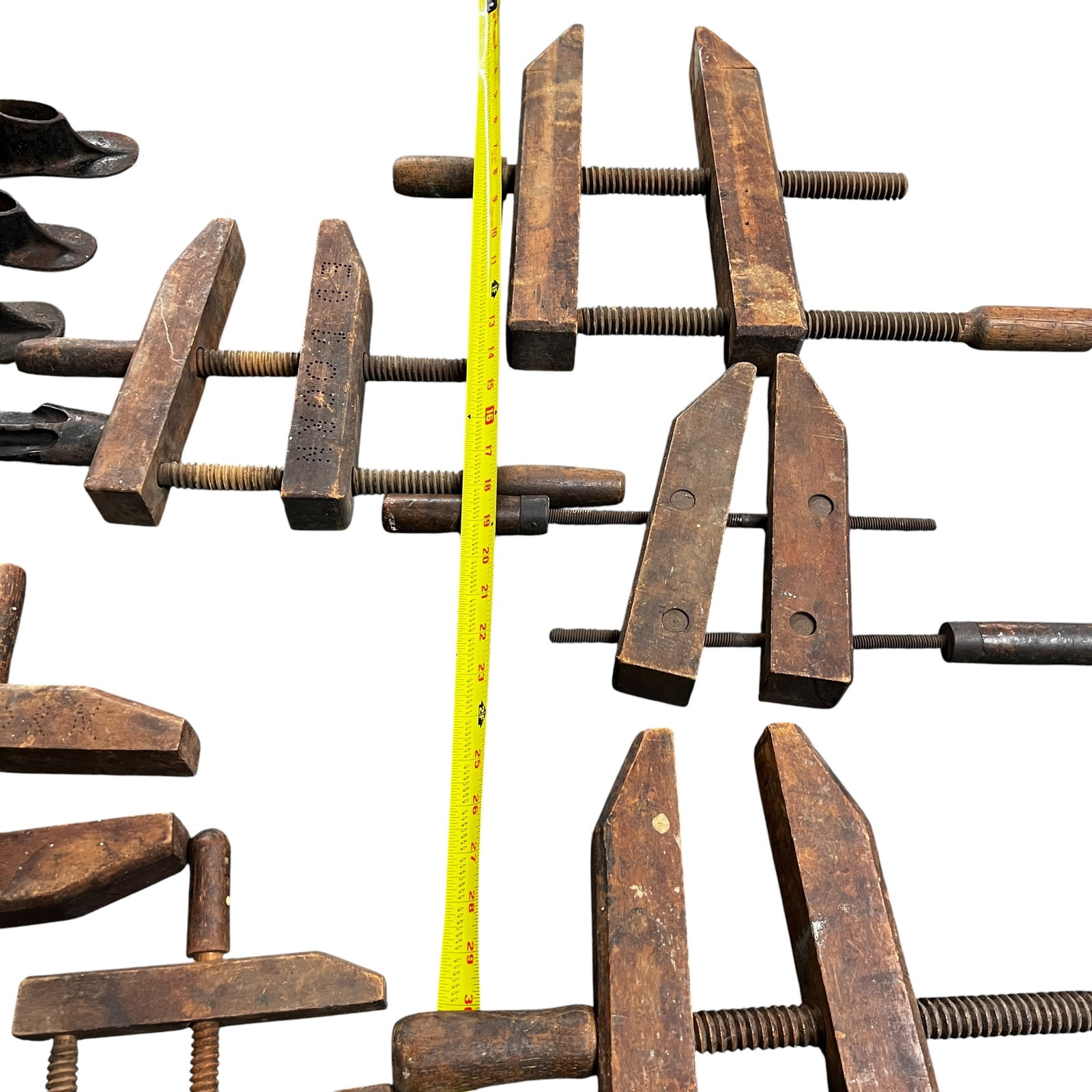 Collection of Antique Woodworking Clamps & Sad Irons: Large mixed lot featuring a selection of antique woodworking tools and household irons. Includes multiple wooden hand screw clamps of varying sizes, showing age, wear, and patina consistent with