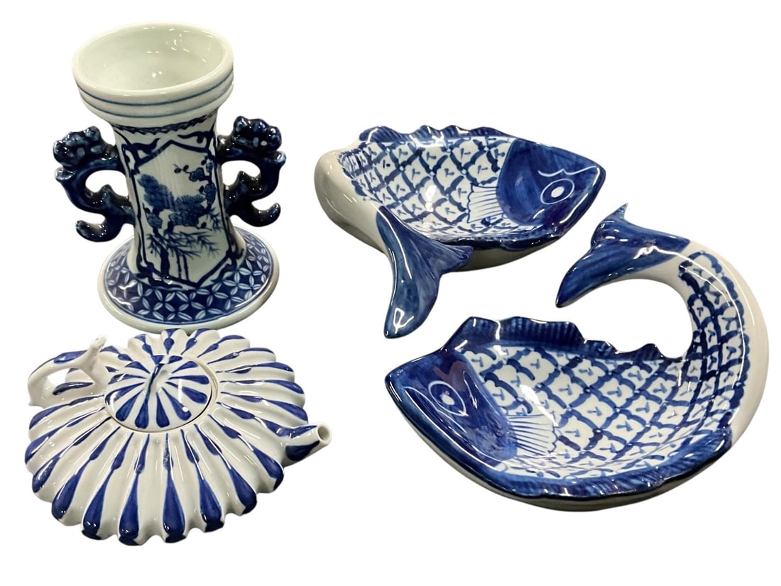 Group of Blue & White Asian Style Porcelain Decorative Articles: Decorative grouping of blue and white porcelain articles in assorted Asian-inspired forms and motifs. Includes a pair of fish-form bowls or dishes, ribbed melon-form teapot with lid, double handled