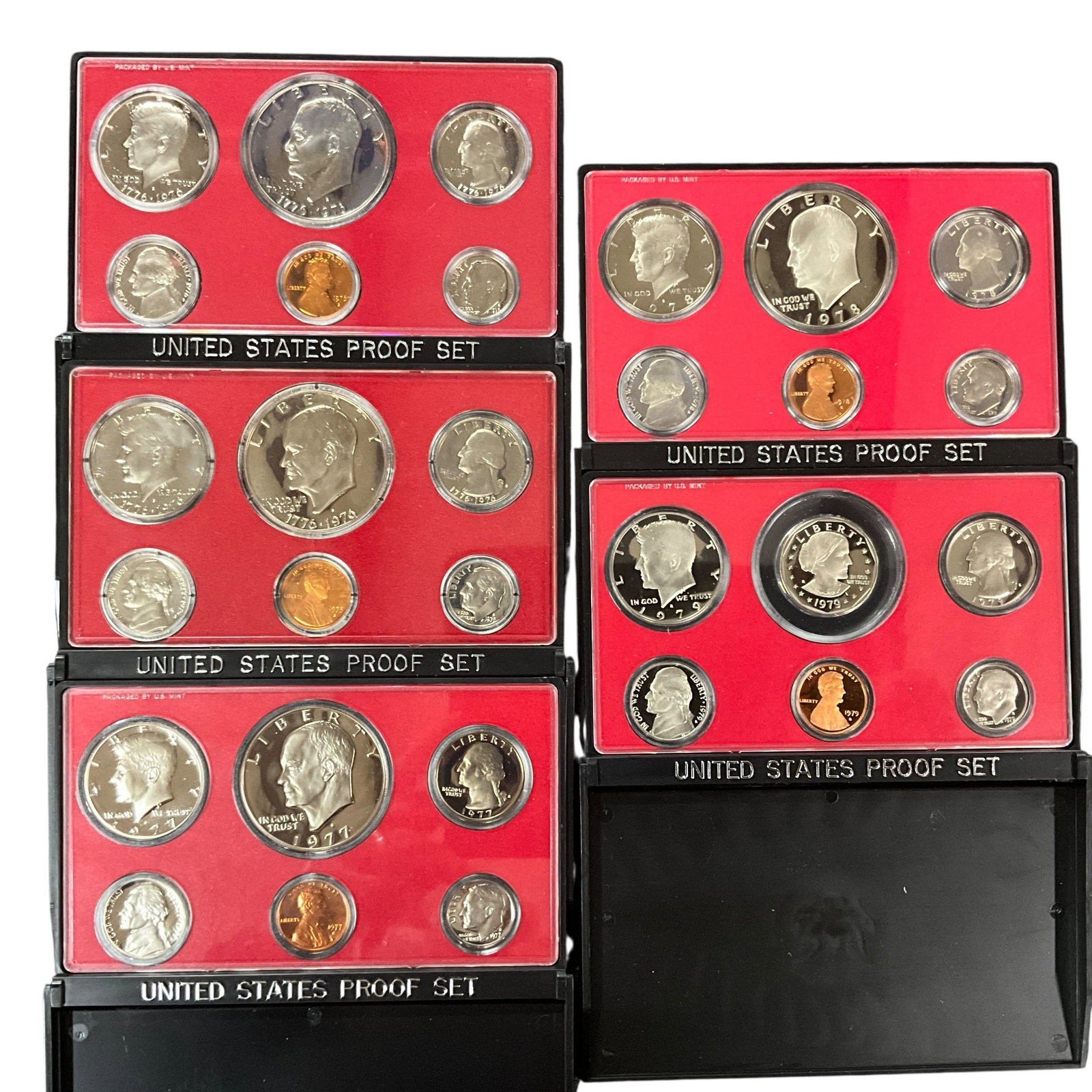Group of 1970s U.S. Proof Sets: Group of United States coin sets from the 1970s, including sets from 1976-1979 U.S. Mint uncirculated coin set in original packaging, together with multiple U.S. Proof Sets in red holders, including v