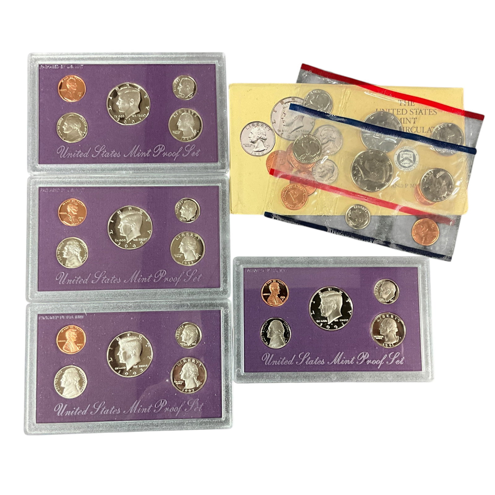 Mixed United States Mint Proof & Uncirculated Coin Sets: Collection of assorted United States Mint proof and uncirculated coin sets including multiple purple-packaged proof sets and mint-issued uncirculated sets. Includes 1990, 1991 (2), 1992, and 1993 exam