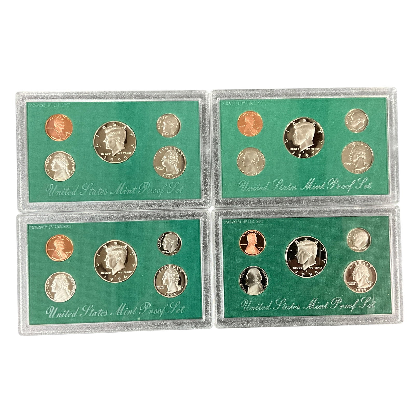 United States Mint Proof & Uncirculated Coin Set Group: Collection of United States Mint proof sets including examples dated 1996, 1997, and 1998. Includes original green government packaging and four hard plastic proof set cases with mirrored proof-strike