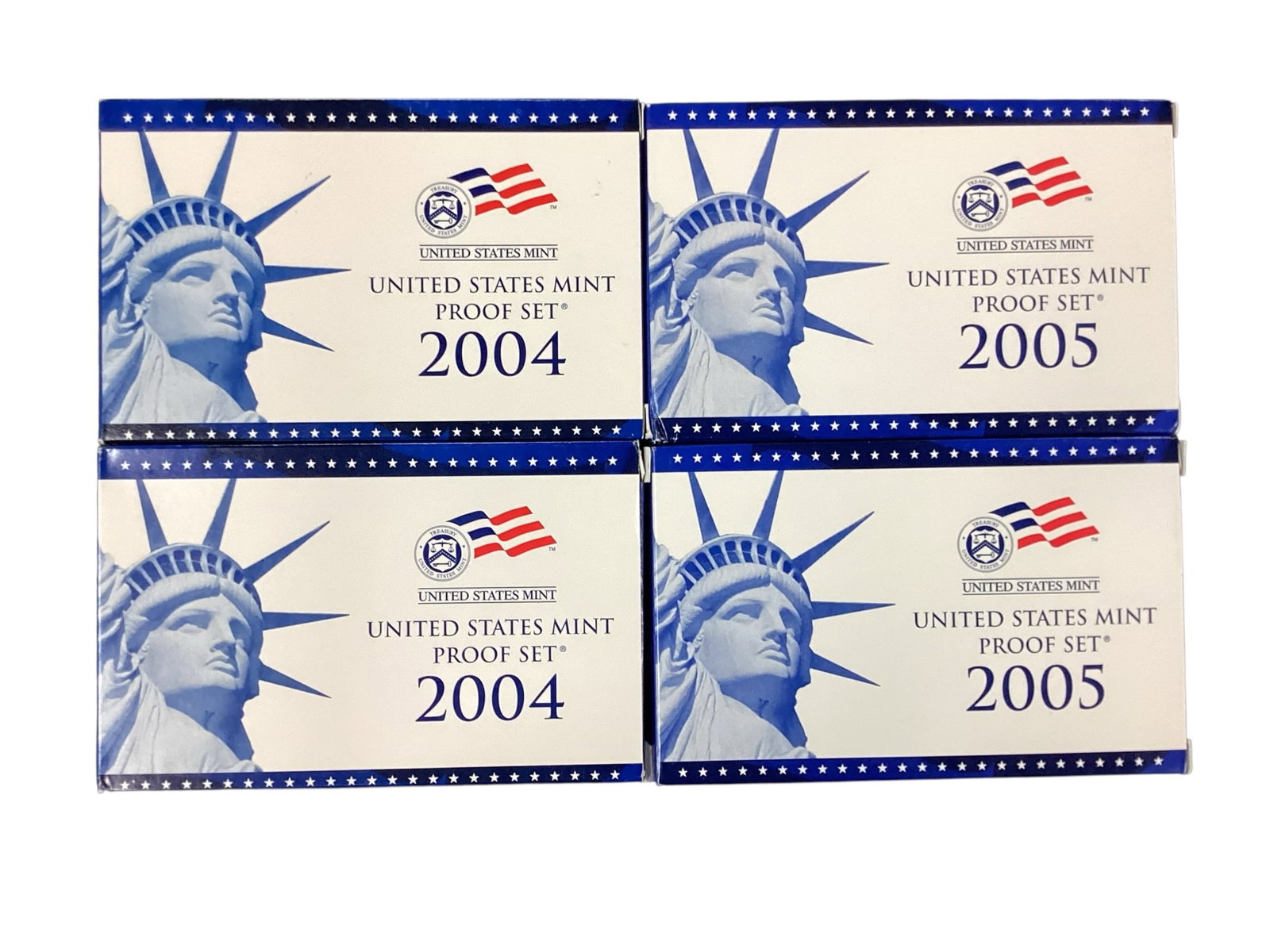 Four United States Mint Proof Sets, 2004-2005: Collection of four official United States Mint Proof Sets including two 2004 proof sets and two 2005 proof sets. Each set contains proof strike circulating coinage and state quarters from the correspo