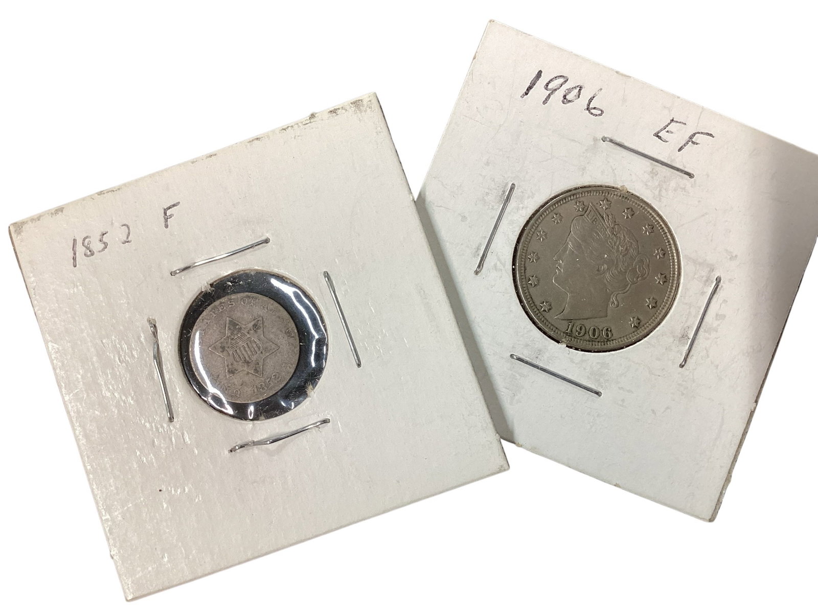 1852 Three-Cent Silver Coin and 1906 Liberty “V?? Nickel: Two-piece United States coin collection including an 1852 Three-Cent Silver (“Trime”) coin and a 1906 Liberty Head “V” Nickel. The silver three-cent piece features the classic six-poin