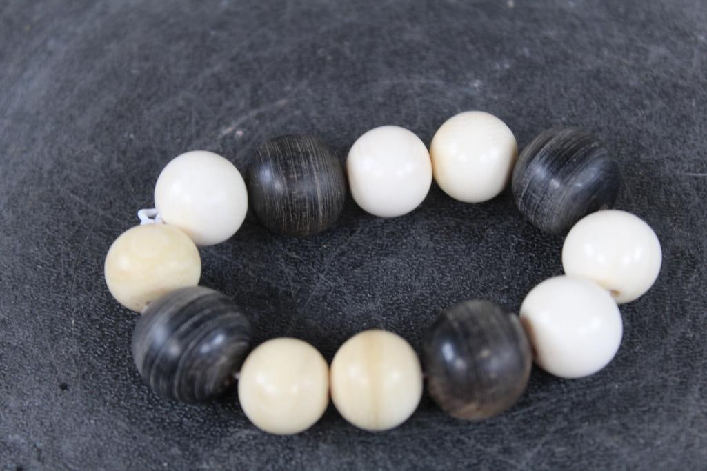 *TEXAS RESIDENTS ONLY* ELEPHANT IVORY and RHINO HORN Bead Bracelet with elastic band: **TEXAS RESIDENTS ONLY**. This Elephant IVORY and RHINO Horn Bead Bracelet has an elastic band and weighs: 1.242oz. TAXIDERMY JEWELRY