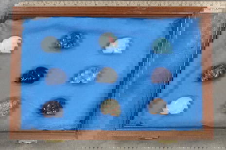 9 Semiprecious Stone and Crystal Skulls in Nice Display with Glass: 9 Semiprecious Skulls. Crystal Quartz, Rose Quartz, Amethyst, Tiger's Eye, Black Obsidian, African Bloodstone, Unakite, Sodalite, and Opalite Skulls. They are displayed in a wooden box with a glass li