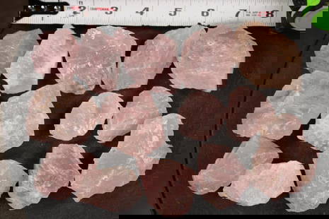 14 Pieces of Natural Raw ROSE QUARTZ (ONE$): 14 Pieces of Natural Raw ROSE QUARTZ. They measure from 1.5" to 2.5" Wide in Diameter each. Total Weight: 2 lbs. Each Rose Quartz stone is irregular and unpolished. They could be used for tumbling, de