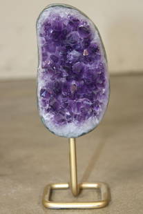 Deep Purple AMETHYST Crystal Cluster on a Metal Stand: Deep Purple Natural AMETHYST Crystal Cluster. The Amethyst measures 5.5" Tall x 2.5" wide and the Total Height is 7.25" Tall on the metal stand. It weighs 1 lb 6 oz. Amethyst crystal clusters are know