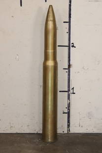 Original Inert 90mm U.S. Military Brass Artillery Shell: Orignial U.S. Miliary Inert 90mm Artillery Shell made of Brass. It measures 34.75" Tall x 4.25" Base Diameter and the Total Weight is 25 lbs 6 oz. The bottom is labeled "MK8 Mod. 1", "713988-0",