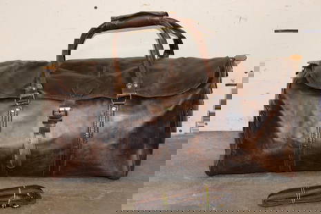 *Brand New* Leather Duffle Bag with an Attachable Strap: *Brand New* Leather Duffle Bag with an Attachable Strap. It measures 25" Long x 14" Wide x 10" Tall. WESTERN LUGGAGE AND BAGS