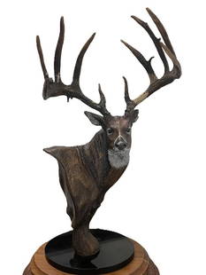 "The Breen Buck" Statue by artist Dick Idol on a Marble and Wood Base: "The Breen Buck" Limited Edition art production by Big Sky Carvers artist Dick Idol. This is a Large and Legendary Whitetail Deer. The plaque reads "The Breen Buck by Dick Idol 1144/1500 N.W.T. F." (N