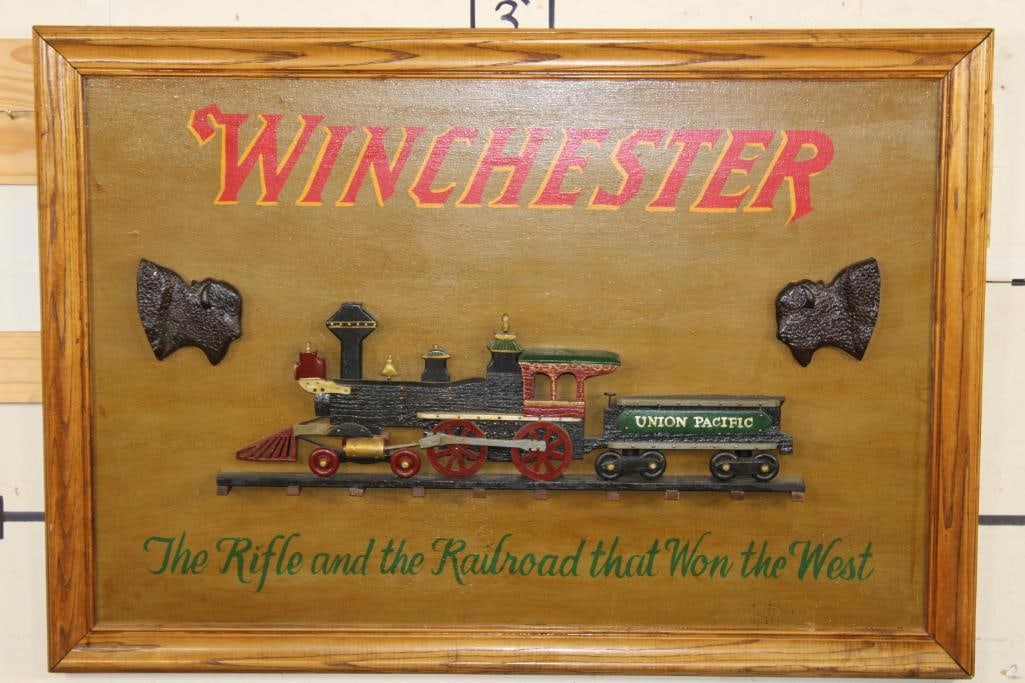 Vintage "Winchester" and "Union Pacific" Hand-painted Wooden Advertisement Sign with Carved Details: Big Vintage "Winchester" Advertisement in a Wooden Frame. It measures 46" Long x 32" Wide. It has been hand-painted with "Winchester" and "The Rifle and the Railroad that Won the West". It has a 