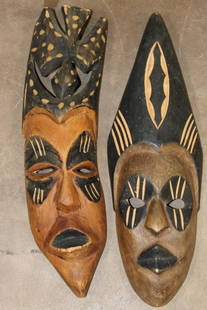 (2) Hand-carved and Hand-painted AFRICAN Tribal MASKS (ONE$): 2 Hand-carved and Hand-painted AFRICAN Tribal Masks. There is a Male and a Female Mask. The Male measures 16" Long x 4.5" Wide and the Female measures 16.25" Long x 5.5" Wide. (ONE$) COLLECTIBLE AFRIC