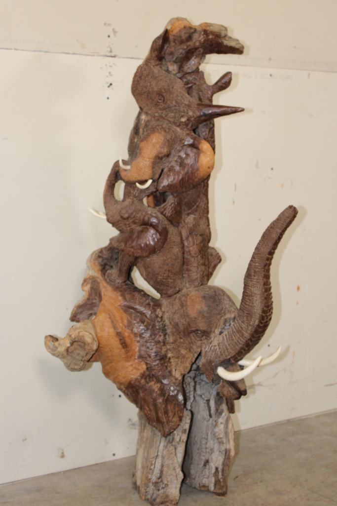 XL 4' Original Leadwood Hand-carved Sculpture "Lucky" by African artist Nhlanhla S. Nkala: XL 4' Original Leadwood Hand-carved Sculpture "Lucky" by African artist Nhlanhla S. Nkala. This stunning sculpture depicts 3 Elephants, 2 Giraffes, and a Rhinoceros. The Elephants Tusks are believed t