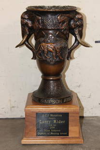 Big S.C.I Houston Bronze "Mike Simpson Legends of Hunting" Trophy from 2014: Big Bronze Safari Club International Houston Trophy. The plaque read "S.C.I. Houston presents Larry Rider with the 2014 Mike Simpson Legends of Hunting Award". The sculpture depicts 2 Elephants, a Lio