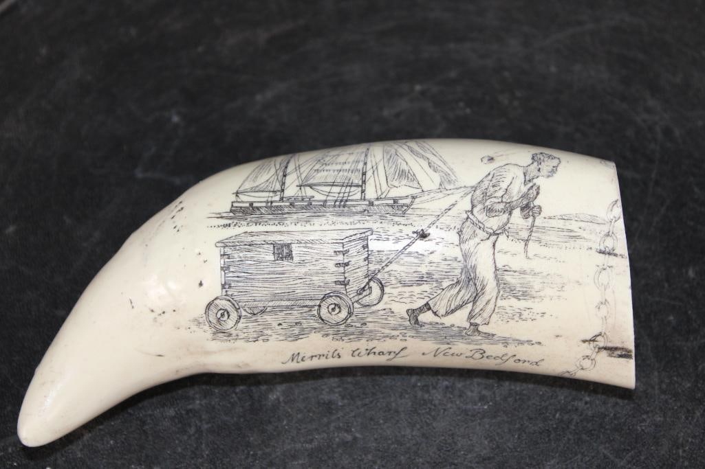 Reproduction Scrimshawed "Merril's Wharf New Bedford" WHALE TOOTH: Reproduction Scrimshawed "Merrils Wharf-New Bedford" WHALE TOOTH. On the reverse side "Freedom" and "Liberty" with a Bald Eagle and shield. It measures 5 3/8" Tall x 2" Long x 1 3/8" Wide and Wei