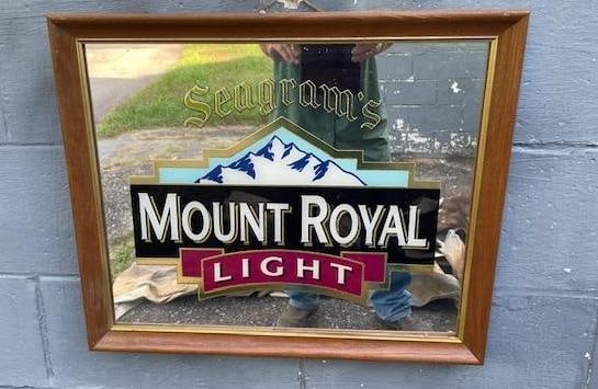 Seagram's Mount Royal Light Reflective Advertisement: Seagram's Mount Royal Light Reflective Canadian Whiskey Advertisement. It is displayed in a wood frame that measures 22.5" Tall x 18.5" Wide. COLLECTIBLE BARWARE ART AND ADVERTISEMENTS 