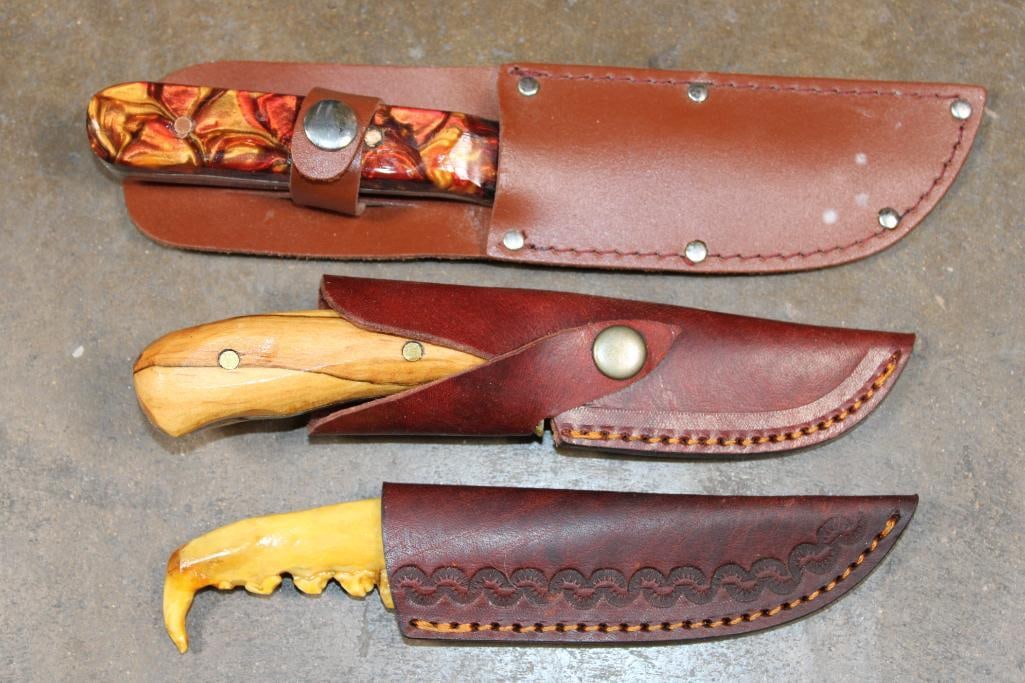 (3) Hand-made Knives with Matching Leather Sheaths: 3 Hand-made Knives with Matching Leather Sheaths. The largest measures 9.25" Long and has a resin handle. The next measures 7.75" Long and has a wood handle. The smallest measures 7" Long and the hand