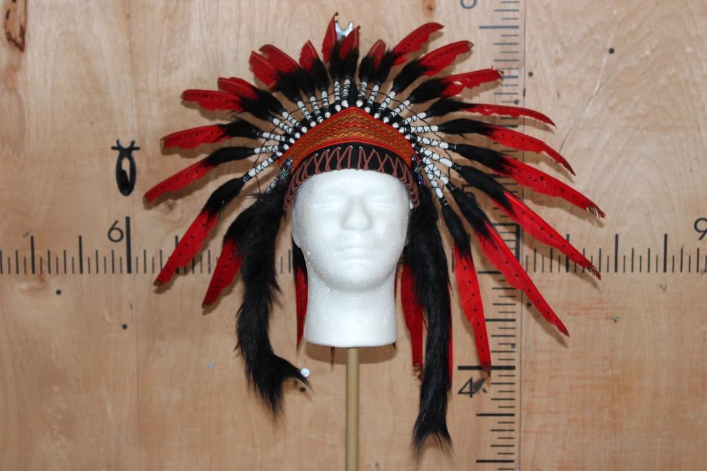 Contemporary Native American WAR BONNET or HEADRESS: Contemporary Native American WAR BONNET or HEADDRESS. It is embellished with Real Feathers and Faux fur. The Headdress has an elastic band that should fit most adults. This feathered headgear