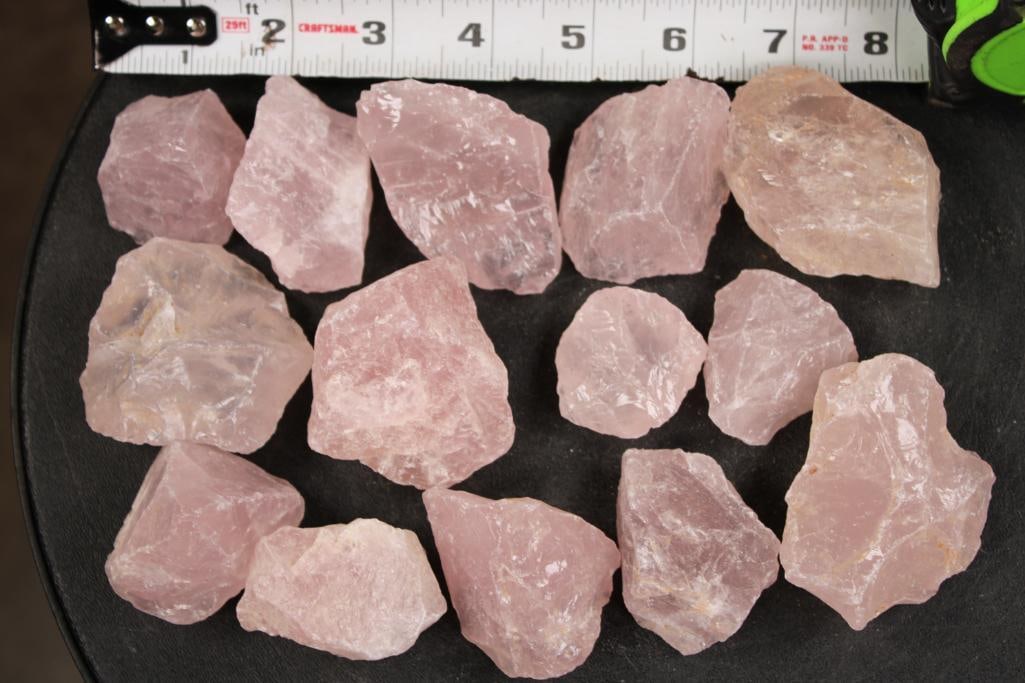 (14) Pieces of Natural Raw ROSE QUARTZ: 14 Pieces of Natural Raw ROSE QUARTZ. Each Rose Quartz stone is irregular and unpolished. They could be used for tumbling, decoration, jewelry making, metaphysical practices and more! ROCKS
