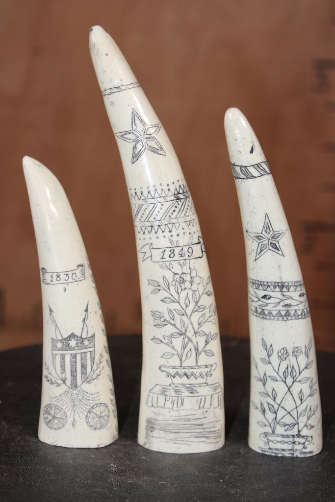 Set of (3) Reproduction Scrimshawed WALRUS TUSKS: Set of 3 Reproduction Scrimshawed WALRUS TUSKS. "1830" with a cornucopia and shield that measures 5.5" Tall x1.5" Long x 1" Wide. "1849" with a painted pot on one side and a peacock on the other. It