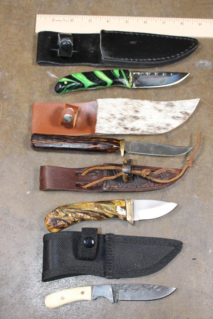 (4) Fixed Blade KNIVES with Sheaths: 4 Fixed Blade KNIVES with Sheaths. The green Knife measures 7" Long and has a resin coated wood handle. The rough wood handle knife measures 8" Long. The yellow and brown marbled handle knife