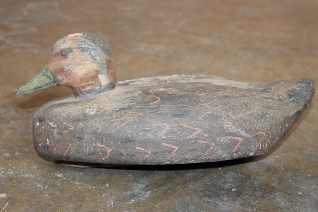 Antique Hand-carved and Painted Wooden DUCK DECOY: Antique Hand-carved and Painted Wooden DUCK DECOY. It has both Brass Tack eyes and is believed to be from the early 1900's. It measures 14" Long x 6.5" Wide x 6" Tall and Weighs 2 lbs 10 oz.
