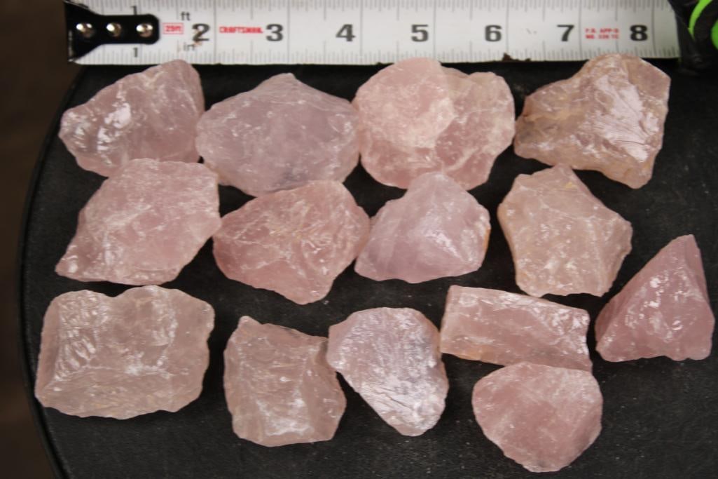 (14) Pieces of Natural Raw ROSE QUARTZ: 14 Pieces of Natural Raw ROSE QUARTZ. They each measure from 1.5" to 2.5" Wide in Diameter. The Total Weight is 1 lb 14 oz. Each Rose Quartz stone is irregular and unpolished. They could be used for