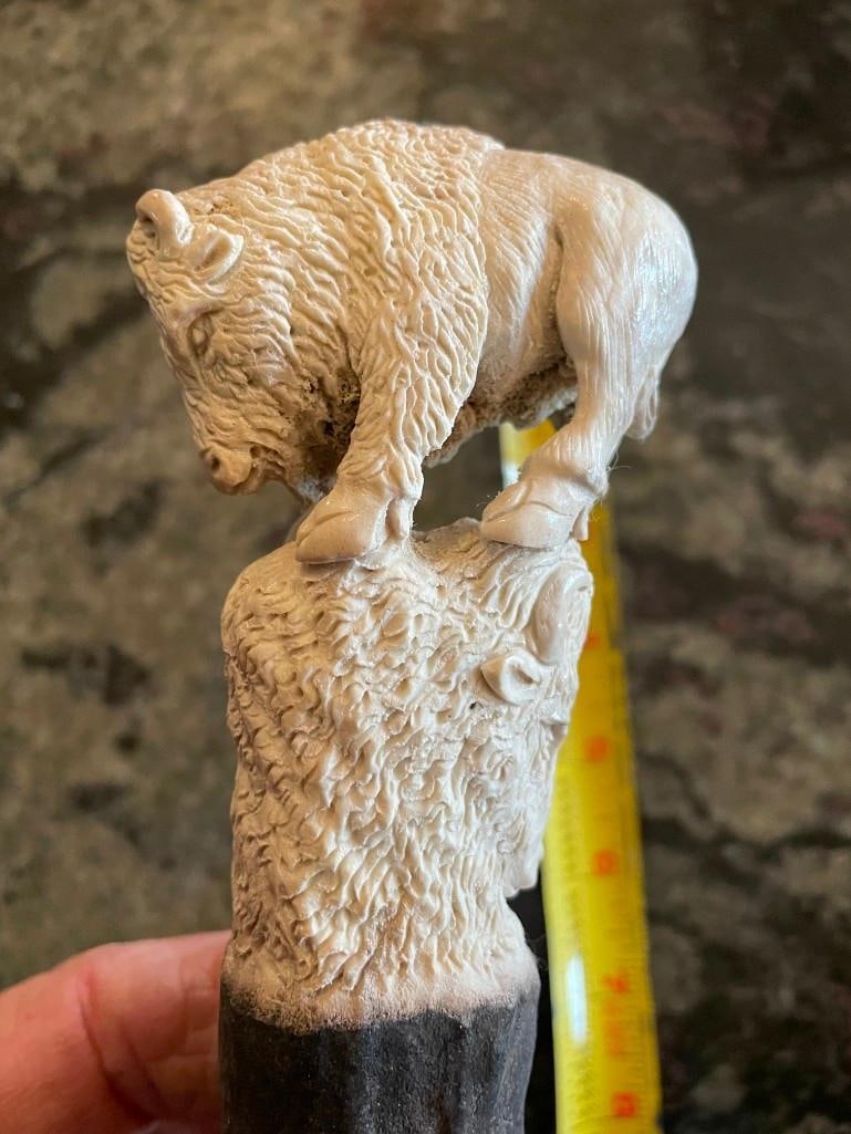Hand-carved STAG ANTLER Handle of a WHITE BUFFALO or BISON Face: Beautiful and Very Detailed Hand-carved STAG ANTLER Handle. It has been skillfully whittled into a WHITE BUFFALO or BISON Face. It measures 5.5" Long. This piece of art will make a unique knife or
