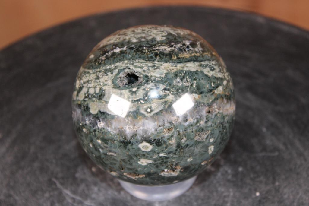 Polished OCEAN JASPER Mineral Sphere with Druzy Inclusions: Stunning Polished OCEAN JASPER Mineral Sphere with Druzy Inclusions. It measures 3.25" in Diameter and Weighs 1.75 lbs. It comes with a plastic ring stand for display. ROCKS FOSSILS MINERALS 