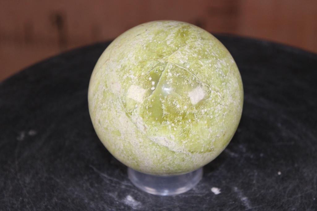 Polished SERPENTINE Mineral Sphere with a Ring Stand: Polished SERPENTINE Mineral Sphere. It measures 3.5" in Diameter and Weighs 1.95 lbs. It comes with a plastic ring stand for display. ROCKS FOSSILS MINERALS 
