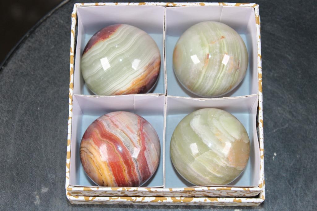 (4) Cut and Polished ONYX Spheres: 4 Cut and Polished ONYX Spheres. They all measure approximately 2" in Diameter and come in the box as shown. This is genuine, natural onyx with varied color and banding patterns. Onyx is used for