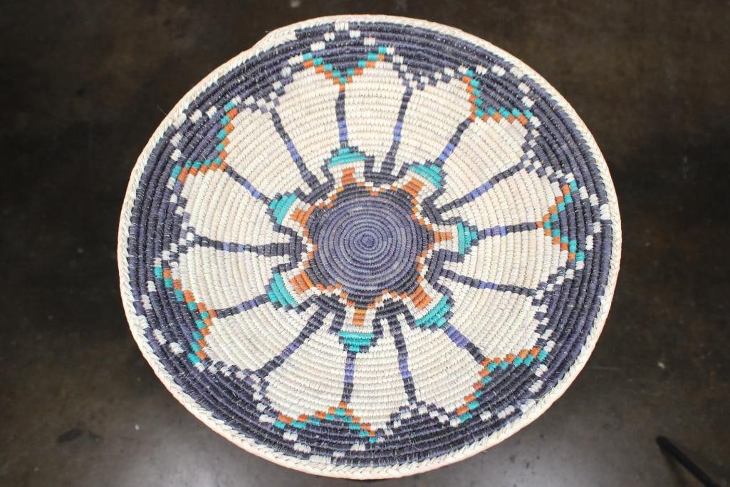 Hand-woven "Eagle Feather" Navajo Inspired Ceremonial BASKET: Hand-woven "Eagle Feather" Navajo inspired Ceremonial BASKET. It measures 14.5" in Diameter x 2.5" Depth. It is woven from dry grass or straw and could be displayed on the wall or used as a