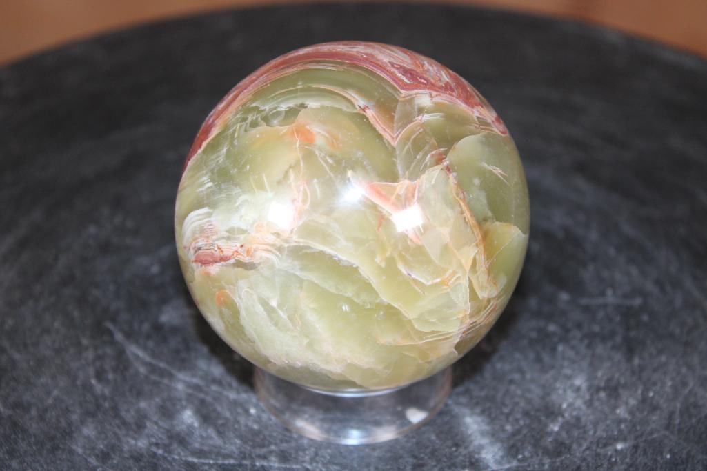Polished GREEN BANDED ONYX Mineral Sphere: Polished GREEN BANDED ONYX Mineral Sphere. It measures 3" in Diameter and Weighs 1.3 lbs. It comes with a plastic ring stand for display. ROCKS FOSSILS MINERALS 