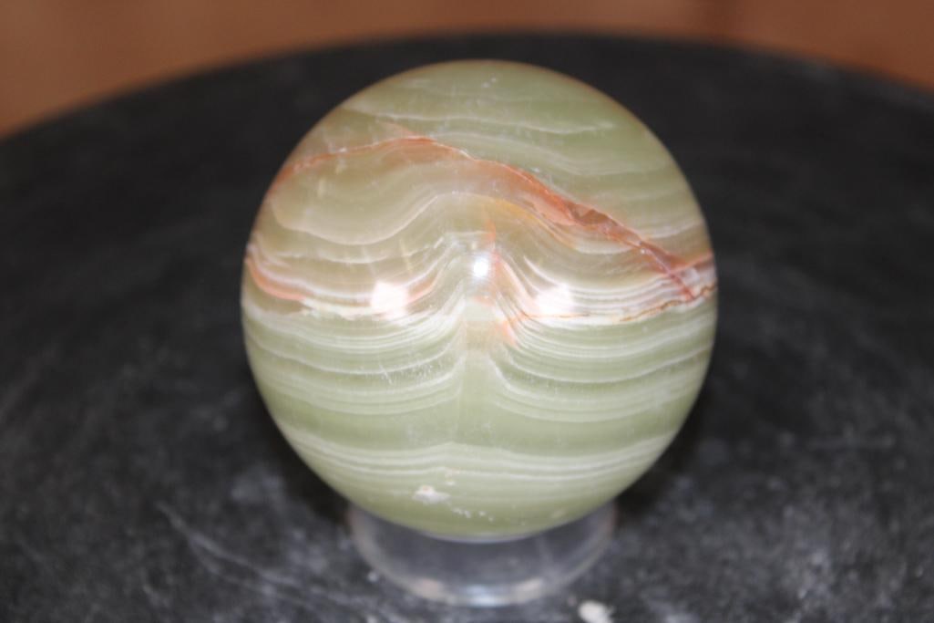 Polished GREEN BANDED ONYX Mineral Sphere: Polished GREEN BANDED ONYX Mineral Sphere. It measures 3" in Diameter and Weighs 1.3 lbs. It comes with a plastic ring stand for display. ROCKS FOSSILS MINERALS 