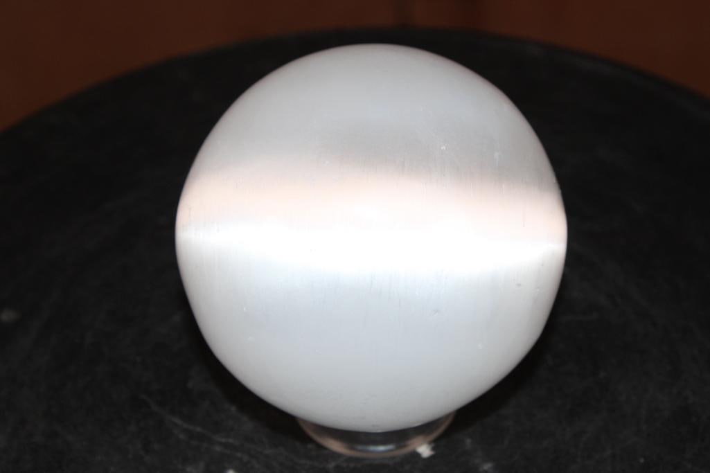 Polished SELENITE Mineral Sphere: Big Polished SELENITE Sphere. It measures 3.75" in Diameter and Weighs 2.2 lbs. It comes with a plastic ring stand for display. This is a moon-like crystal ball made from the mineral gypsum. It is kno