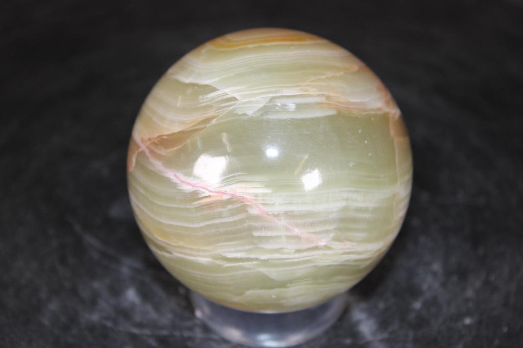 Polished GREEN BANDED ONYX Mineral Sphere: Polished GREEN BANDED ONYX Mineral Sphere. It measures 3" in Diameter and Weighs 1.3 lbs. It comes with a plastic ring stand for display. ROCKS FOSSILS MINERALS 