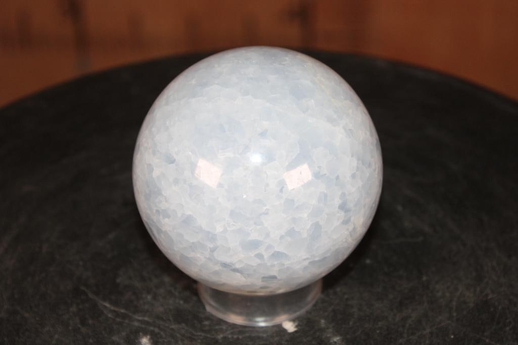 Polished BLUE CELESTITE Mineral Sphere: Polished BLUE CELESTITE Mineral Sphere. It measures 3 3/8" in Diameter and Weighs 1.95 lbs. It comes with a plastic ring stand for display. ROCKS FOSSILS MINERALS 