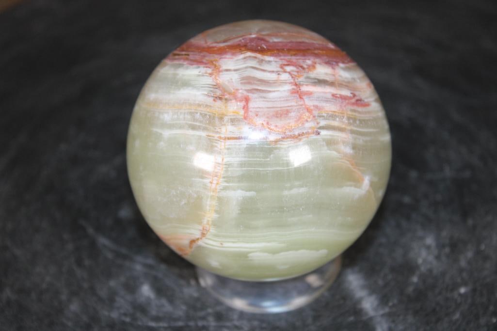 Polished GREEN BANDED ONYX Mineral Sphere: Polished GREEN BANDED ONYX Mineral Sphere. It measures 3" in Diameter and Weighs 1.3 lbs. It comes with a plastic ring stand for display. ROCKS FOSSILS MINERALS 
