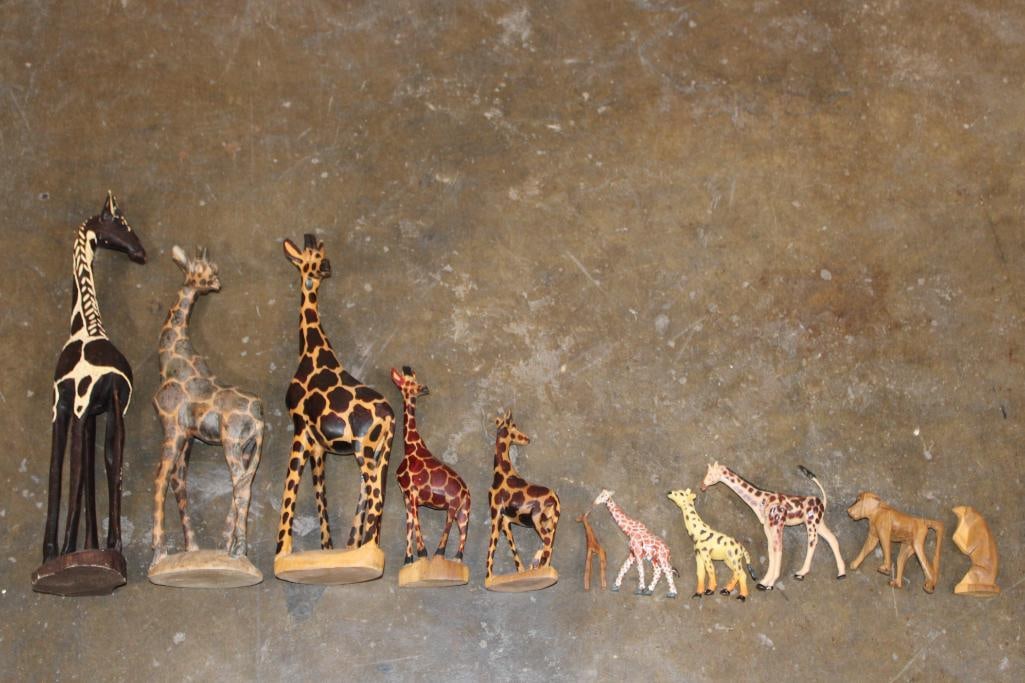 (11) Hand-carved Wooden Animal Figurines: 11 Hand-carved and Hand-made African Animal Figures. There are 9 striking Giraffes, 1 Baboon, and 1 Monkey. COLLECTIBLE AFRICAN ART 