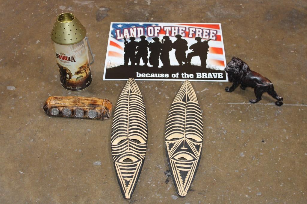 *Bundle* (2) African MASKS from Zimbabwe, Bahamian Coin Display, USA Metal Sign, Amarula Candle: *Bundle* 2 African MASKS from Zimbabwe. Bahamian Coin Display with 4 Coins. "Land of the Free" Metal Sign, Amarula Liqueur Candle Lantern. Hand-carved Lion (it has a broken tail). AFRICAN