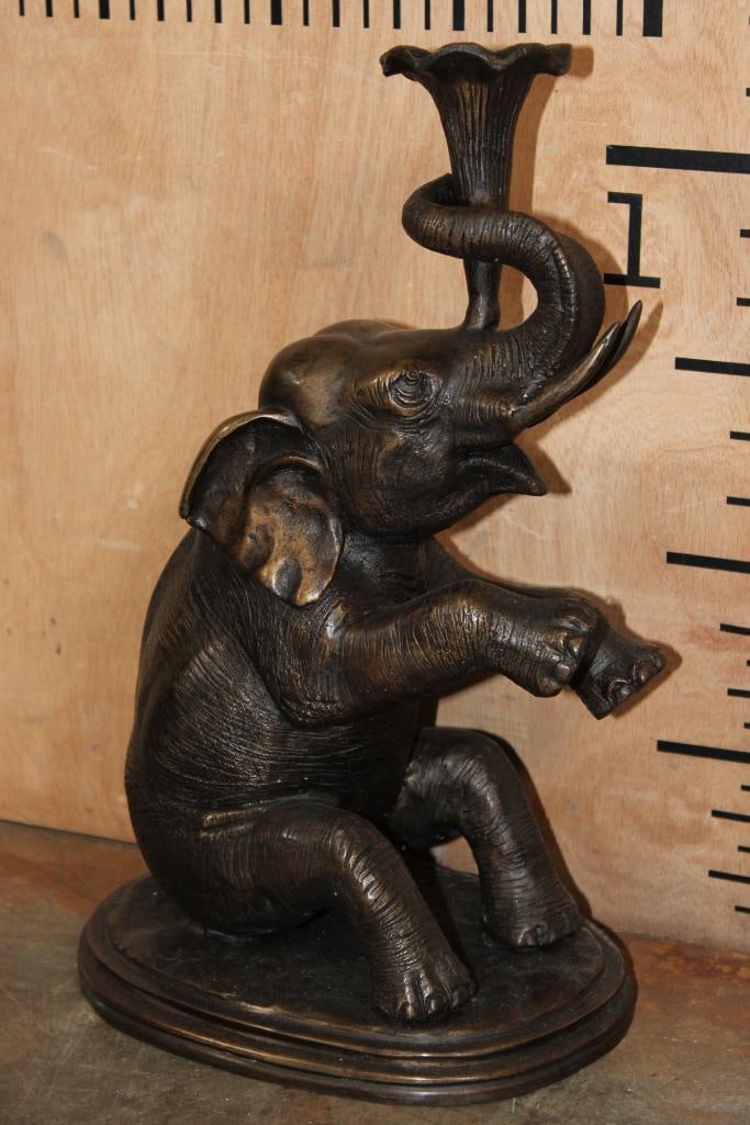 BRONZE Elephant with a Flower Sculpture Candlestick Holder, Weight: 8 lbs: BRONZE Elephant with a Flower (Candlestick Holder) Sculpture. It measures 9.5" Long x 7" Wide x 14.25" Tall. The Total Weight is 8 lbs. COLLECTIBLE BRONZE SCULPTURES 