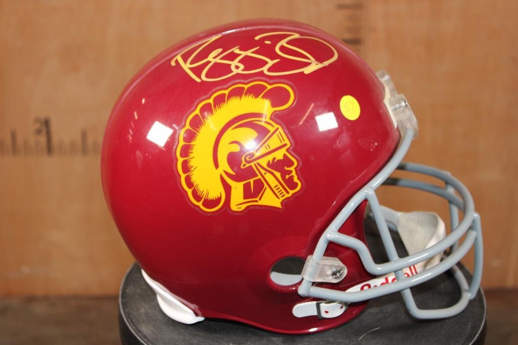 Autographed Reggie Bush USC Helmet with a COA: Autographed Reggie Bush USC Helmet complete with Certificate of Authenticity sticker (on the back of the helmet). It measures approximately 12" Long x 10" Wide x 10" Tall. COLLECTIBLE SPORTS