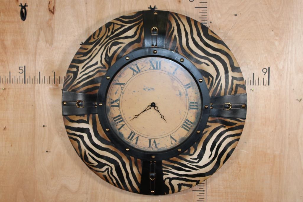 Large Decorative Zebra MIRROR with Faux Leather Straps: Large Decorative Zebra MIRROR with Faux Leather Straps. It measures 36.5" in Diameter. It takes 1 AA Batteries. DECORATIVE WALL CLOCKS 
